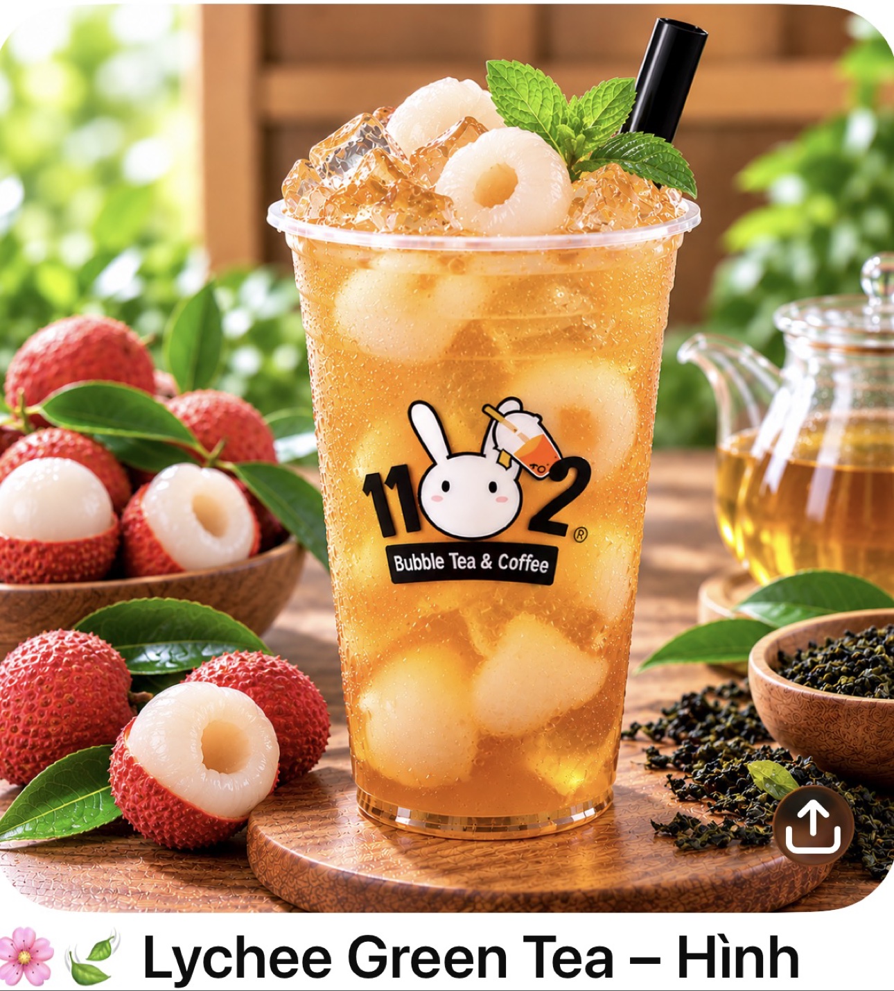 Lychee green tea in a cup with the 1102 shop logo
